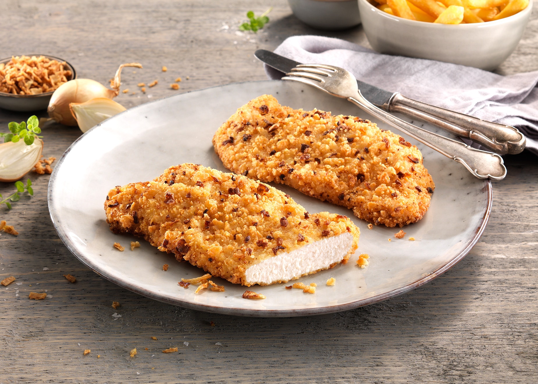 Hähnchenschnitzel Röstzwiebel mit 8% Flüssigwürzung Hähnchenschnitzel Röstzwiebel mit 8% Flüssigwürzung von Bofrost