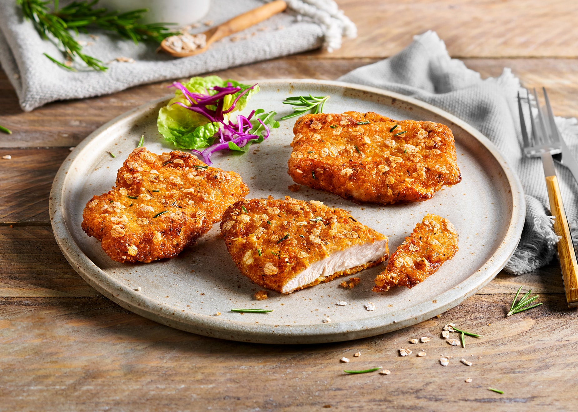 Hähnchenschnitzel in Rosmarin-Dinkelpanade mit 8% Flüssigwürzung Hähnchenschnitzel in Rosmarin-Dinkelpanade mit 8% Flüssigwürzung von Bofrost
