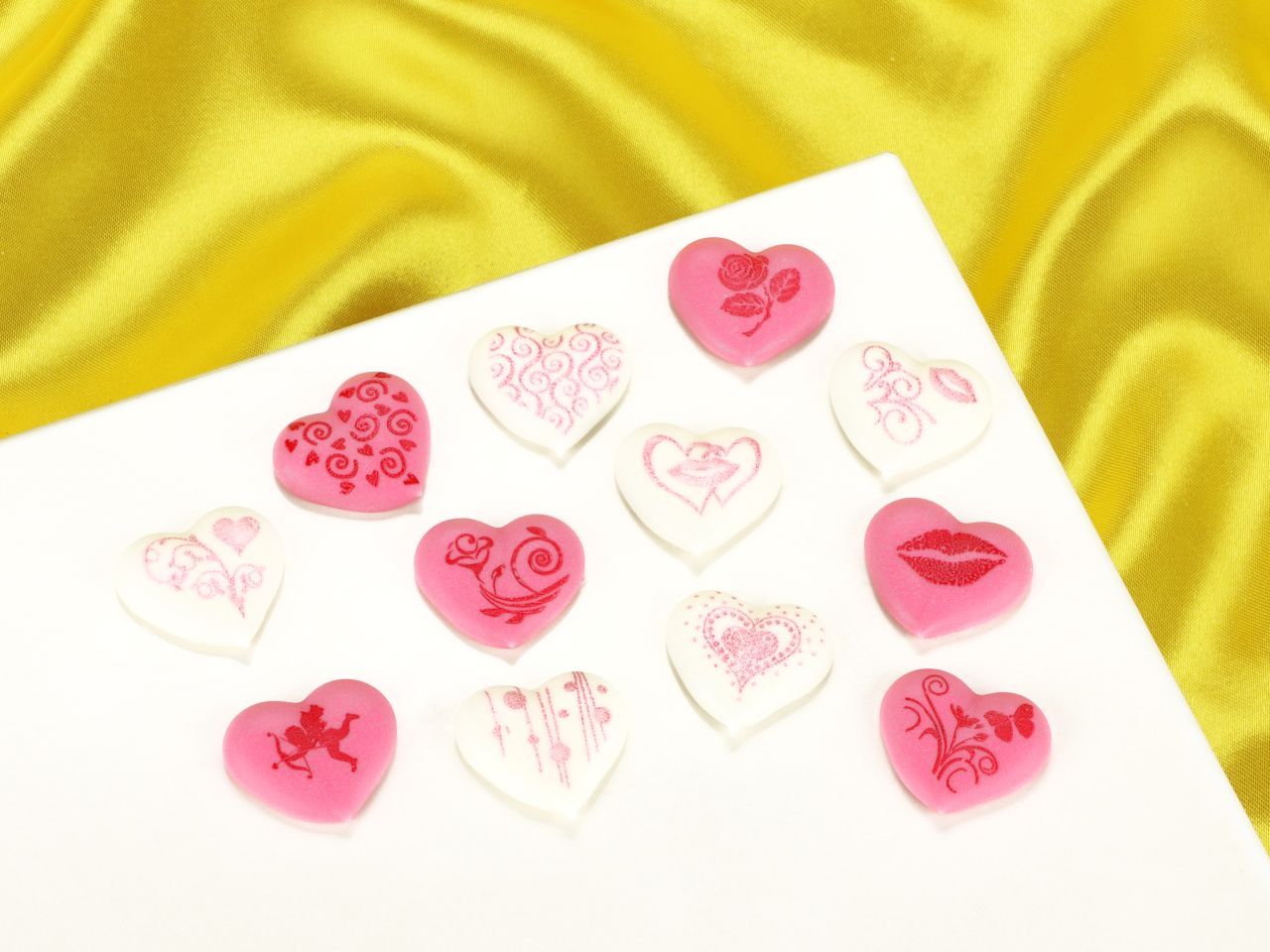 Herzen mit Motiven weiß-rosa Zucker 24 Stück Herzen mit Motiven weiß-rosa Zucker 24 Stück von Cake-Masters