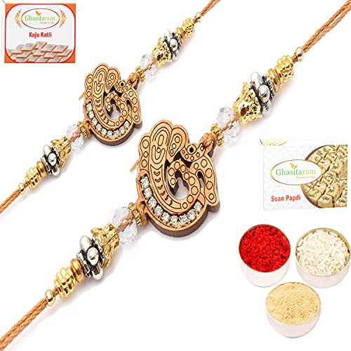 Ghasitaram Gifts Rakhi for Brother Rakhis Online - Set of 2 Om Ganeshay Diamond Ehnic Divine Rakhi with 200 gms of Kaju katli and 200 gms of Soan Papdi von Ghasitaram Gifts