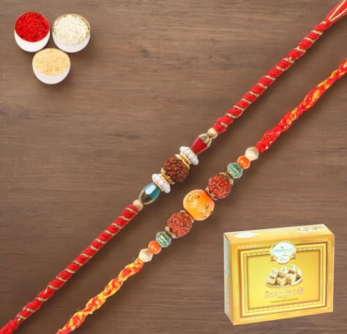 Ghasitaram Gifts Jaiccha Rakhi for Brother Rakhis Online - Set of 2-L-1 and L-3 Rudraksh Rakhi with 200 gms of Soan Papdi Ghasitaram Gifts Jaiccha Rakhi for Brother Rakhis Online - Set of 2-L-1 and L-3 Rudraksh Rakhi with 200 gms of Soan Papdi von Jaiccha